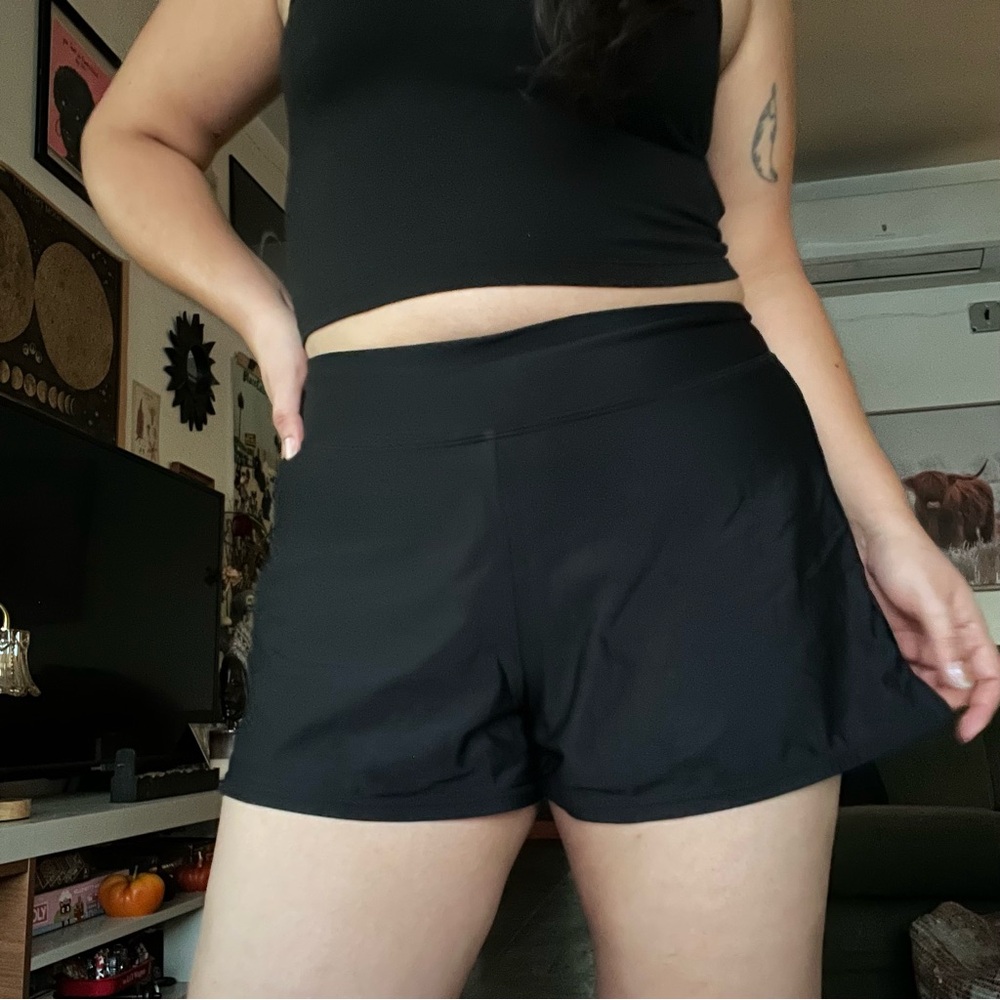 Black swim shorts with side slits